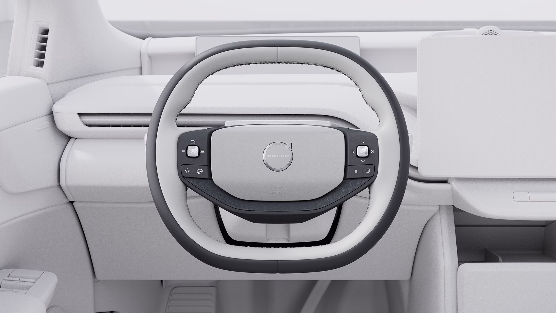 Рулевое колесо Volvo со встроенными кнопками управления и логотипом Volvo в центре крупным планом.