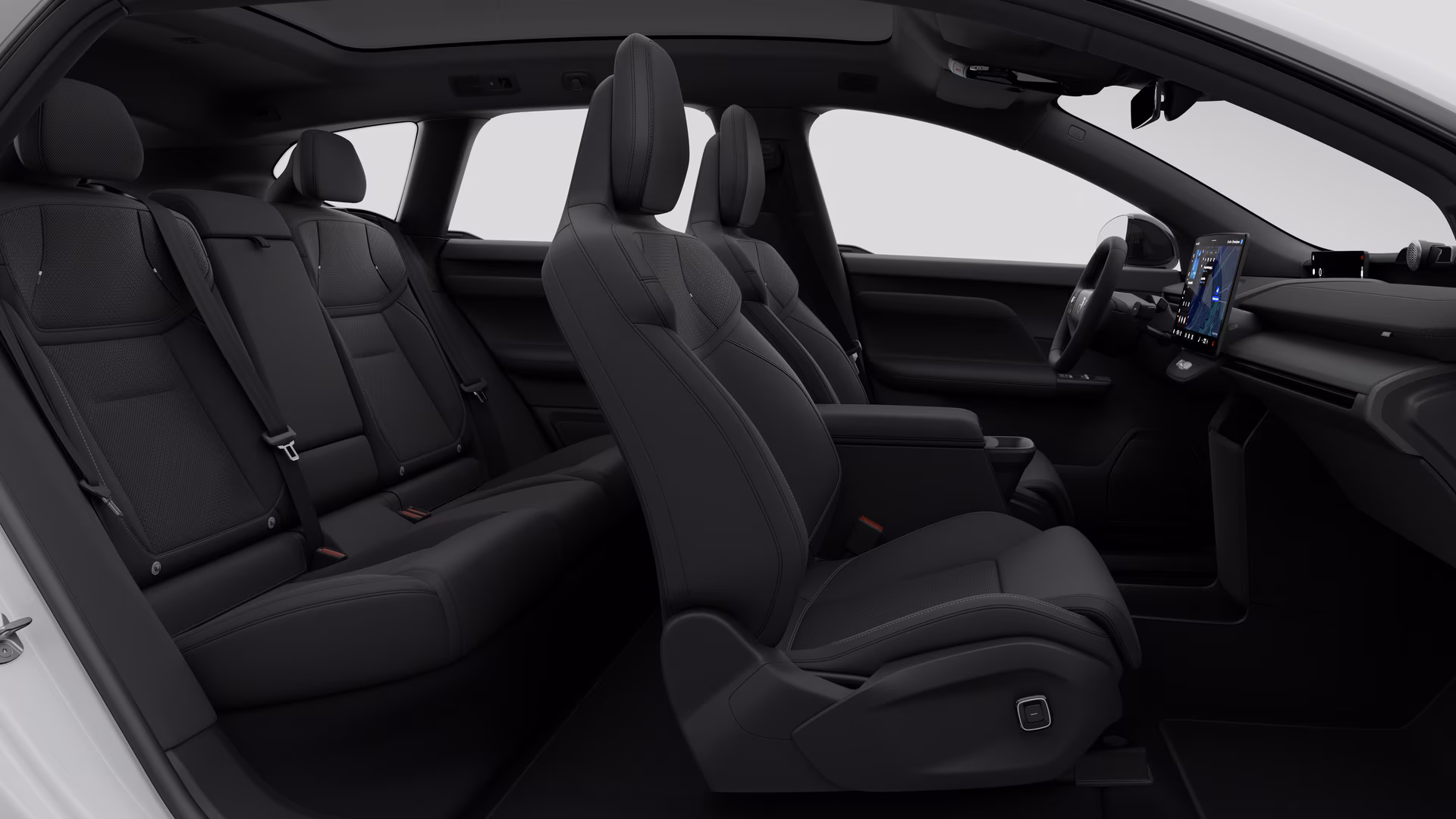 Салон автомобиля Volvo: передние сиденья, задние пассажирские сиденья, руль, приборная панель и центральная консоль на фоне студии.