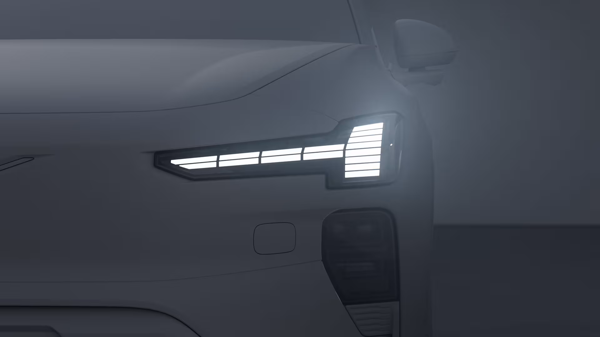 Крупный план фары автомобиля Volvo с характерным сегментированным светодиодным дизайном.