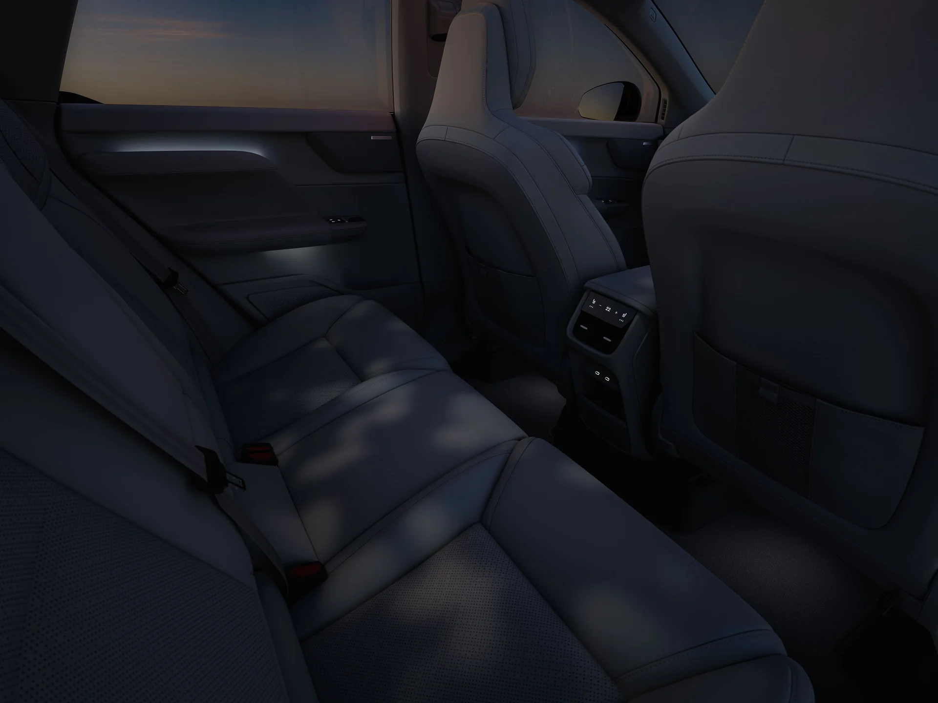 Задняя часть салона Volvo EX60 с проекцией Forest Light, создающей узорчатое рассеянное свечение на сиденьях.