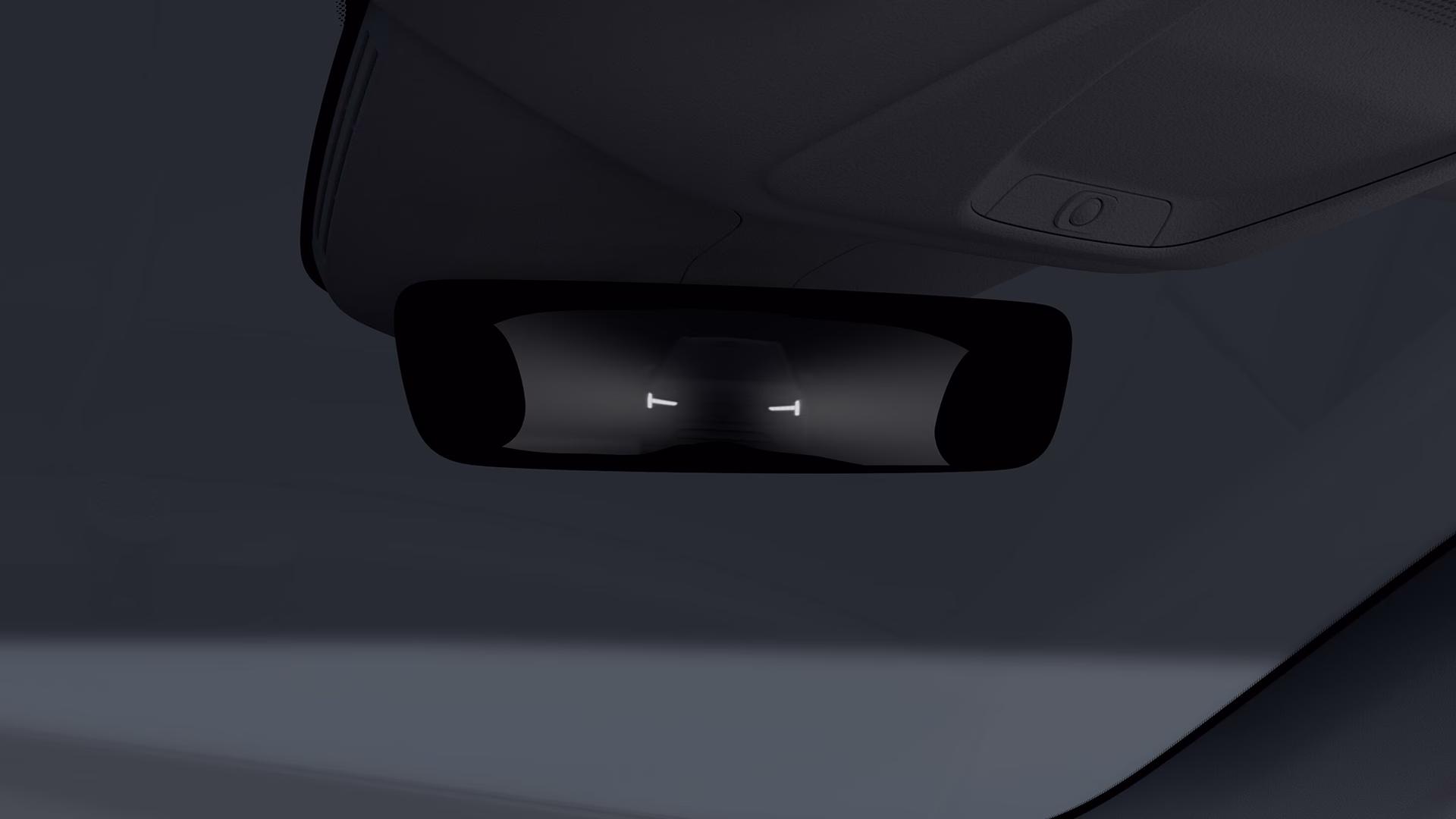 Цифровое зеркало заднего вида внутри автомобиля Volvo, в котором отображаются фары автомобиля, едущего сзади.