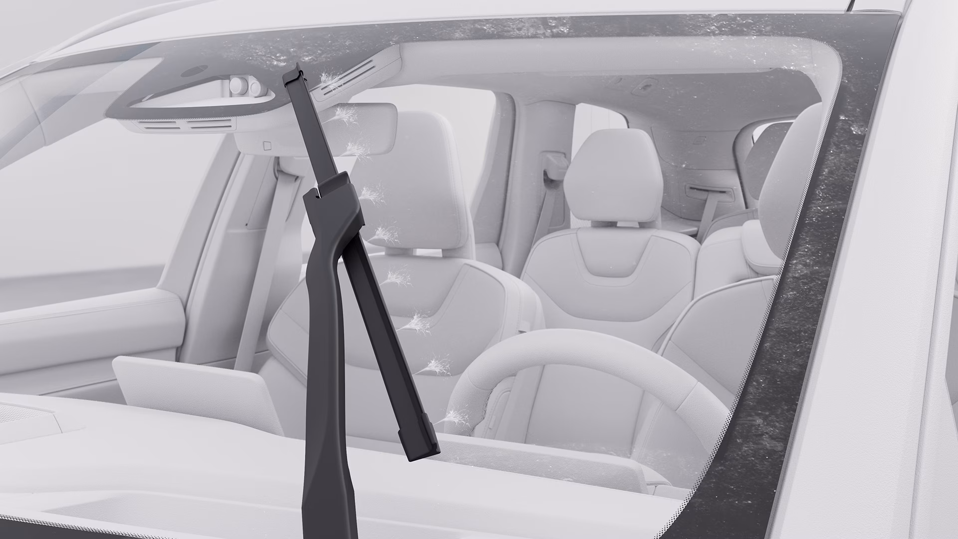 Крупный план лобового стекла автомобиля Volvo с вращающимся стеклоочистителем, подчеркивающий действие по очистке стекла.