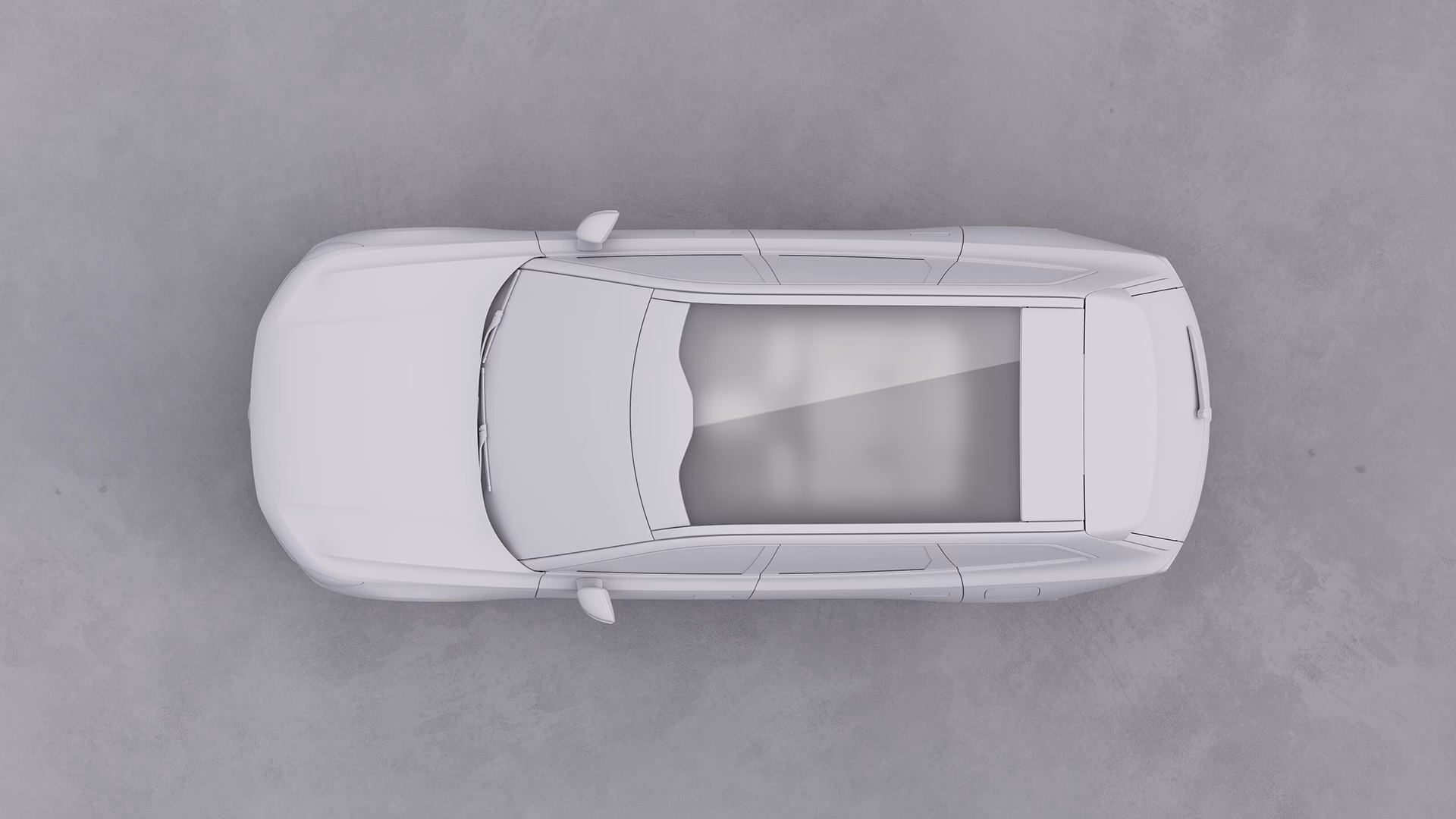 Вид сверху на автомобиль Volvo с большой панорамной стеклянной крышей.
