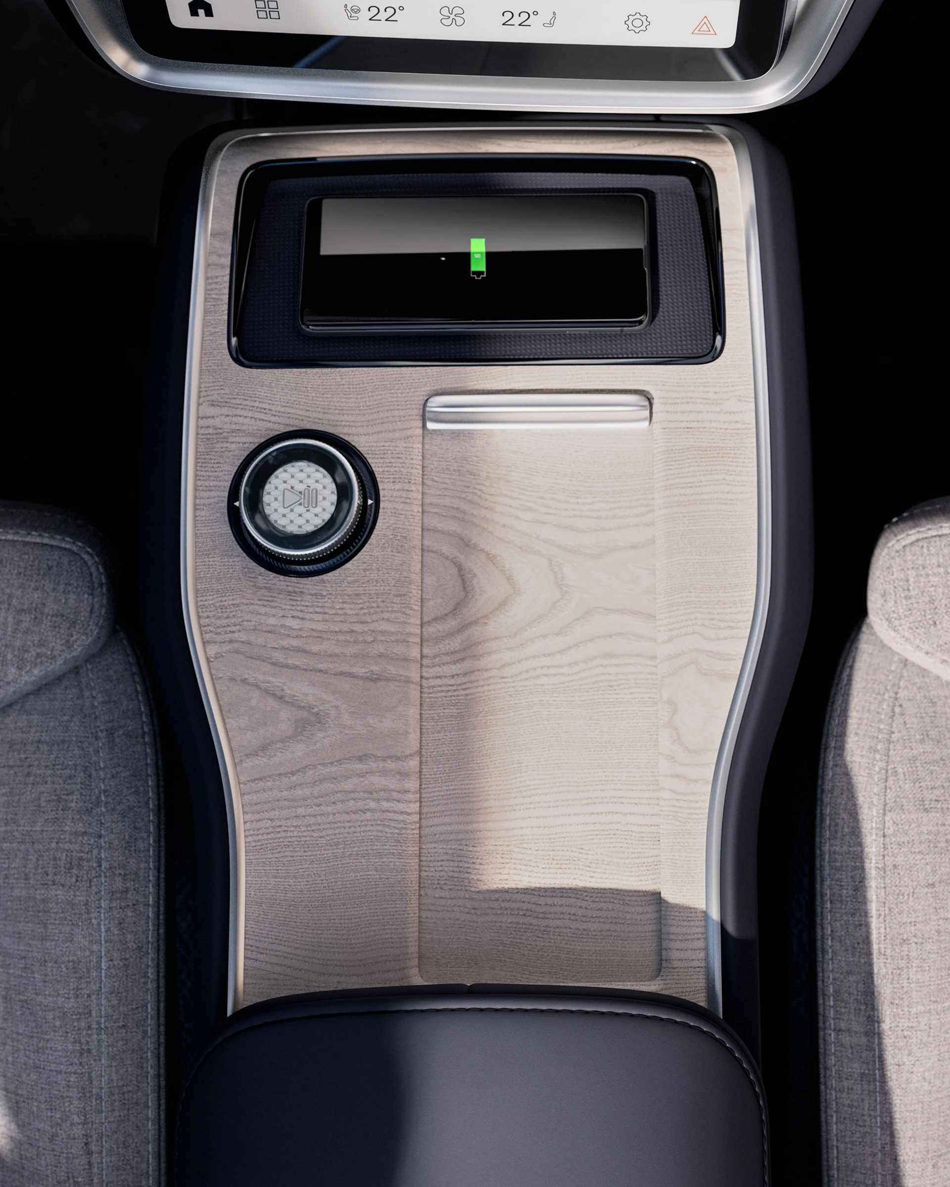Крупный план центральной консоли Volvo EX90 с удобной площадкой для хранения и зарядки.