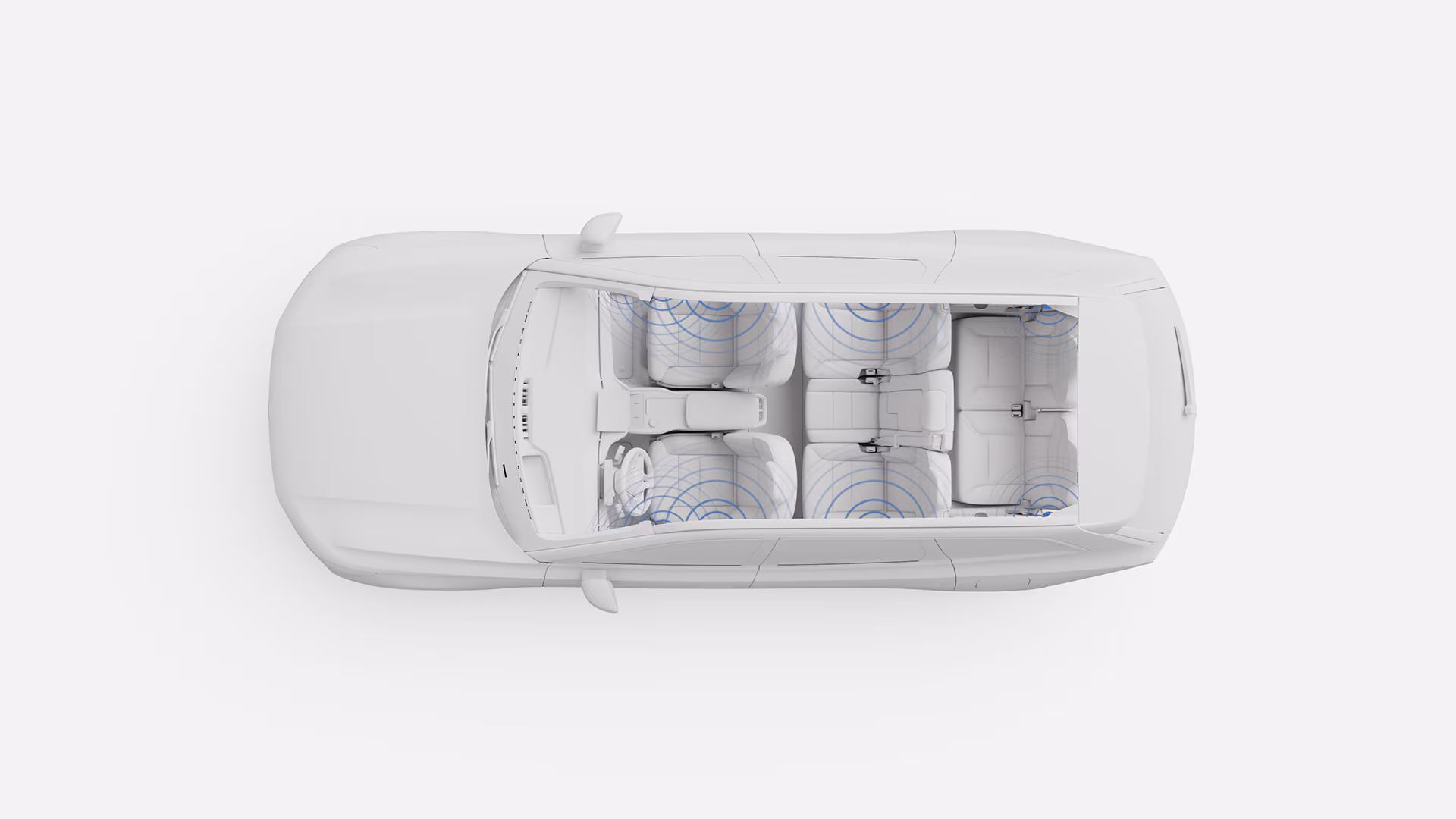 Вид сверху вниз на салон автомобиля Volvo, сиденья выделены синими кругами, иллюстрирующими покрытие аудиосистемы или акустической системы автомобиля.