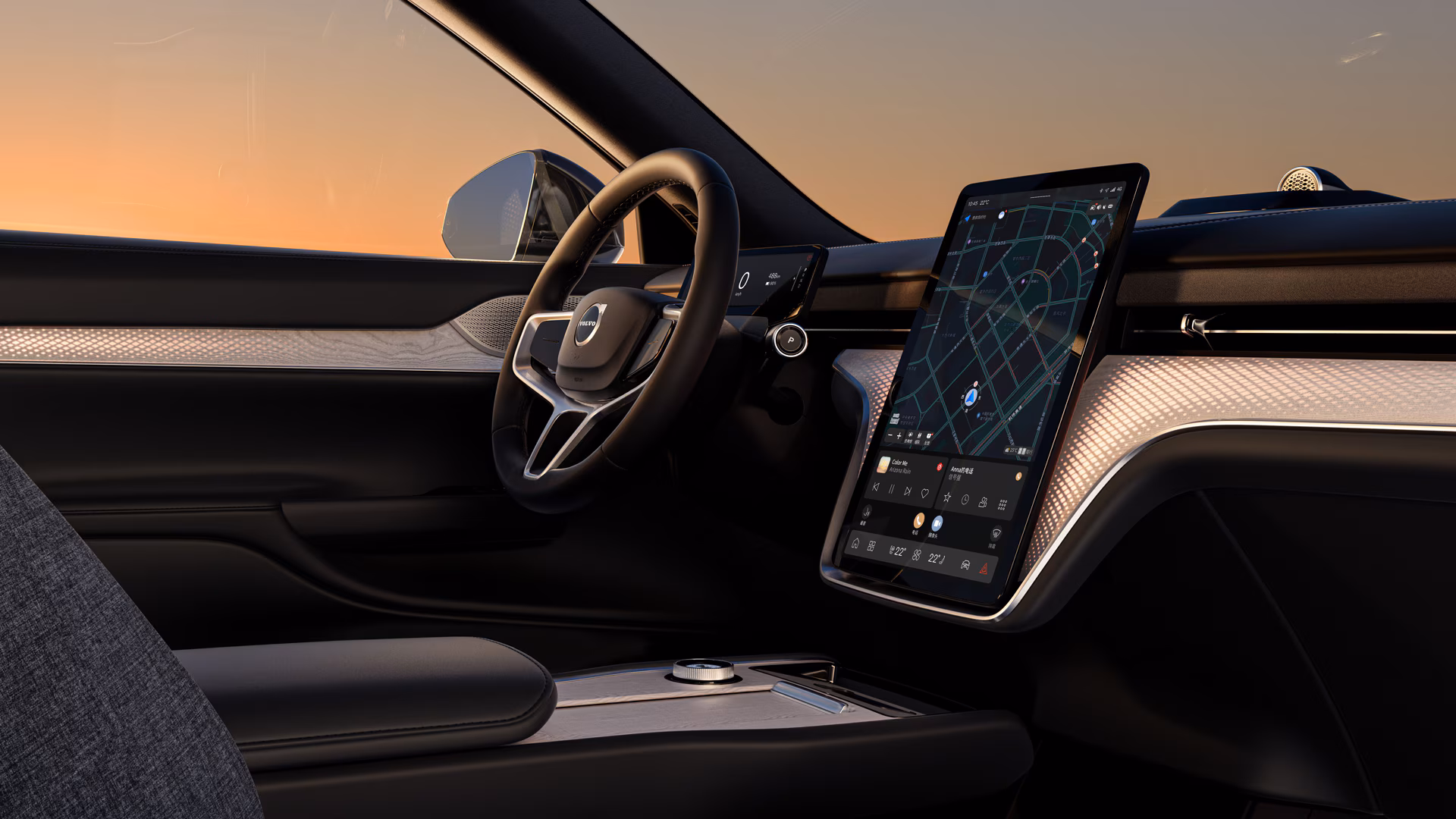 Салон автомобиля Volvo с рулевым колесом, цифровым дисплеем водителя и большим центральным сенсорным экраном с навигацией и элементами управления.