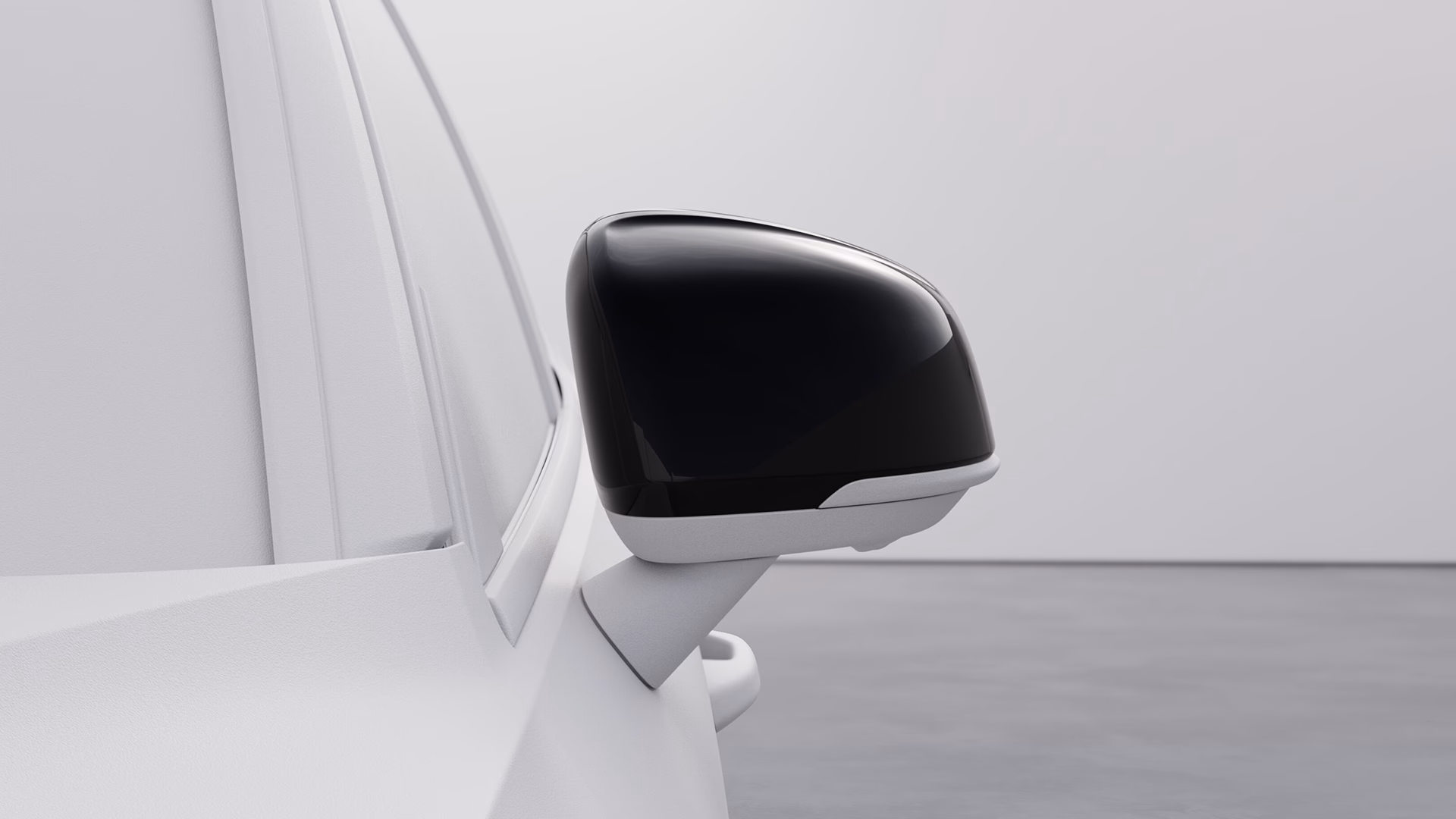 Боковое зеркало Volvo крупным планом с современным двухцветным дизайном.