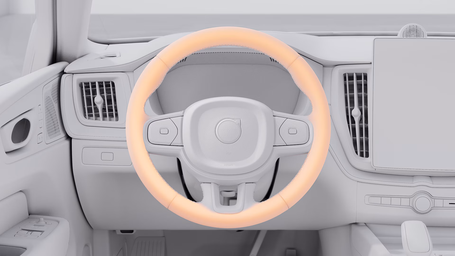 Крупный план салона Volvo: рулевое колесо с подсвеченным ободом, демонстрирующее функцию обогрева рулевого колеса.