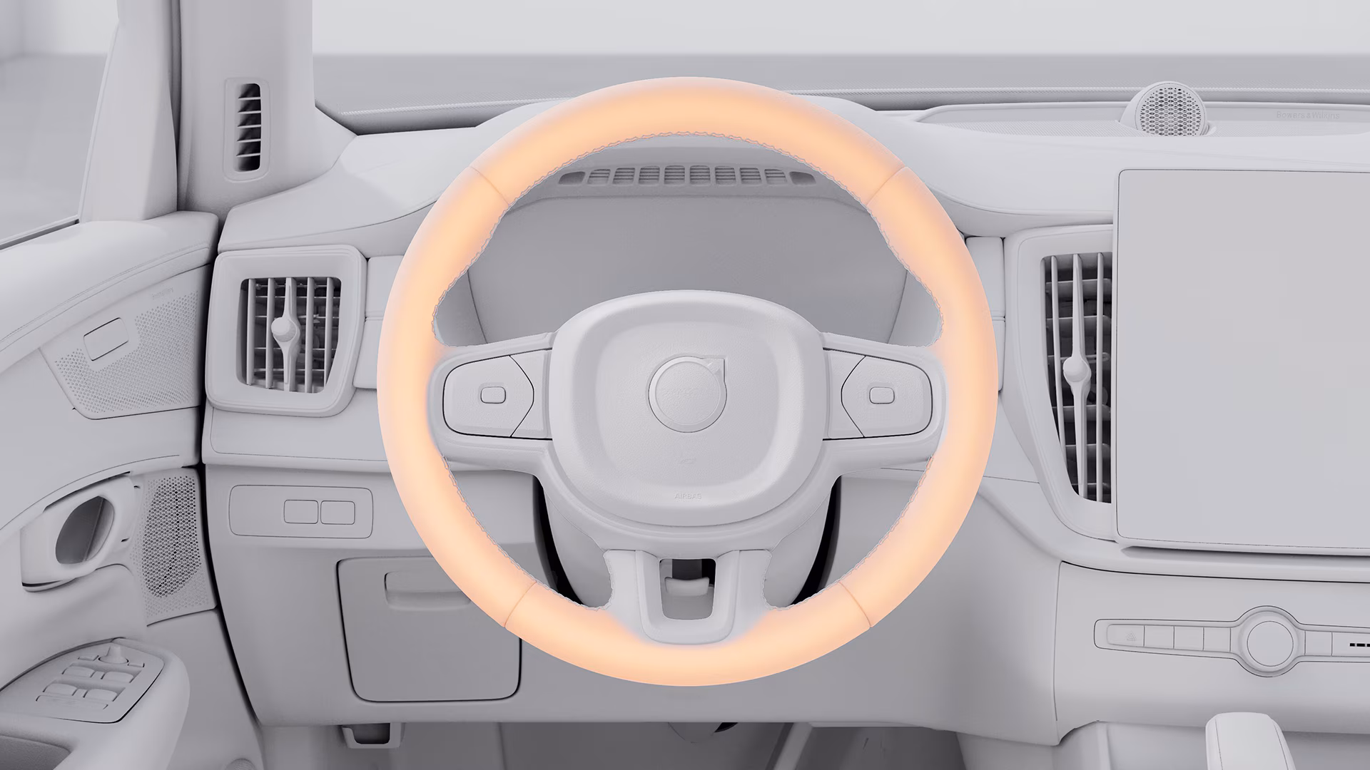 В салоне автомобиля Volvo виден руль с оранжевым индикатором по ободу, указывающим на активацию системы помощи водителю.