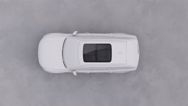 Вид сверху на белый внедорожник Volvo с панорамным люком на крыше.