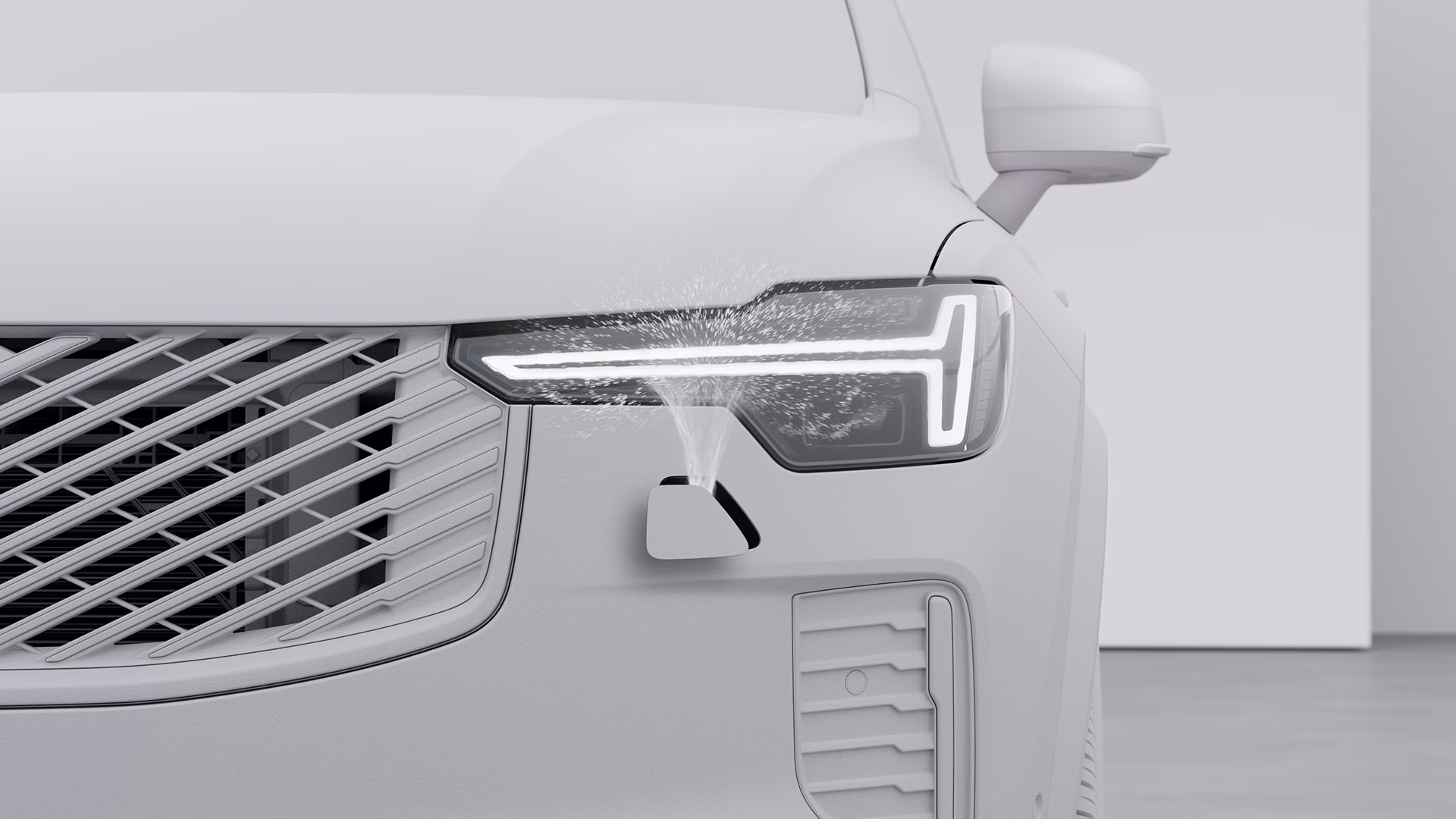 Крупный план, фары автомобиля Volvo, очищаемые автоматической системой очистки фар.